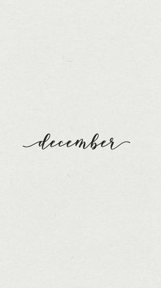 a black and white photo with the word december written in cursive writing on it