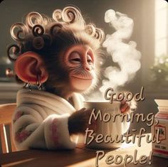 a monkey sitting at a table with a cup of coffee in his hand and the words good morning beautiful people written on it