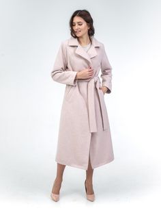 "Introducing our Beige/Light Pink Mohair Wool Wrap Midi Coat--a timeless classic. This iconic piece combines a relaxed wrap front with a midi-length silhouette, meticulously crafted from a sumptuously soft and exceptionally warm blend of wool and mohair. Elevating your style, it features a self-tie belt, notched lapels, and defined shoulder pads for a look that's effortlessly sophisticated. Blending classic design with exceptional craftsmanship, each of our coats is meticulously crafted and hand-finished using the finest fabrics in Europe. Fits to size. Our model is 172 cm and wears size S 36 Details: Notched collar Defined shoulder pads Vertical pockets Self-tie belt Fully lined Slit back Fabric & Care: Coat-50% mohair, 25% wool, 25% polyamide Lining- 100% viscose Heavy-weight fabric Care Winter Wrap Coat, Pink Coats For Women, Pink Wool Coat, Wool Wrap Coat, Types Of Textiles, Wool Coat Women, Wool Wrap, Wool Winter, Pink Coat