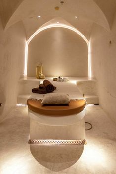 a spa room with white walls and lights