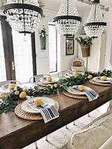 a dining room table with plates and lemons on it