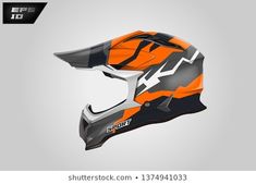 an orange and black helmet on a gray background