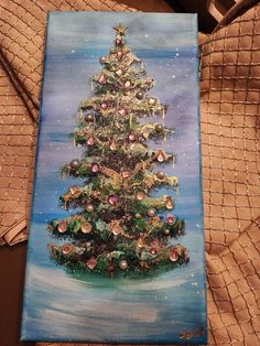 a painting of a christmas tree on a canvas