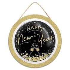 a happy new year clock hanging from a rope