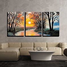 three paintings hanging on the wall in a living room