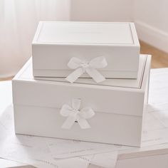 two white boxes sitting on top of each other