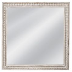 a white framed mirror with beading around the edges