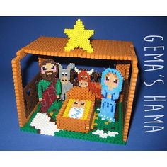 a nativity scene made out of legos on a blue background with the words genma's maha written below it