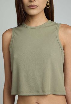 Size: one size fits xs/s and m  color: sage  sleeveless top  48% polyester 48% rayon 4% spandex  dry clean recommended  by the nkc store    product measurements:  bust: 77.47cm / 30.50in  length: 38.73cm / 15.25in Olive Stretch Top For Summer, Olive Stretch Summer Tops, Stretchy Olive Summer Tops, Summer Stretch Olive Tops, Spring Sage Tops For Ladies, Green Tank Top For Spring Layering, Sleeveless Olive Top For Summer, Sleeveless Khaki Top For Layering, Khaki Sleeveless Top For Layering