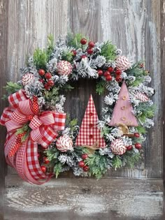 a christmas wreath with red and white decorations