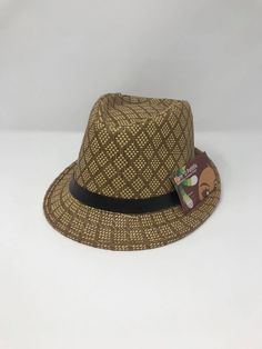 Looking for a dapper look? Hat is the perfect addition to your spring and summer wardrobe. With the lightweight and cool material of this hat, you'll be sure to stay cool and stylish all year long. This hat is for both women and man. Side of the hat has a space to clip flower to it for girls! This listing is for one hat only. Color: brown and tan Size: 57cm-58 cm Guaranteed fast shipping! Adjustable Retro Summer Hat, Summer Brown Fedora With Short Brim, Summer Brown Fedora For Kentucky Derby, Trendy Short Brim Hat, Brown Brimmed Panama Hat For Spring, Brown Summer Panama Hat, One Size Fits Most, Brown Fedora Hat For Summer, Brown Summer Panama Hat With Short Brim, Brown Casual Panama Hat For Summer