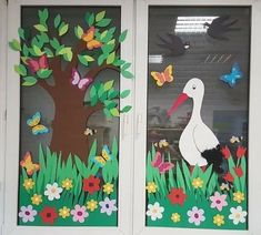 two doors decorated with paper flowers and birds