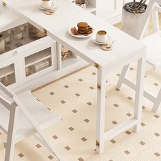 a white table with chairs and plates on it