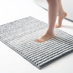 a person standing on top of a mat