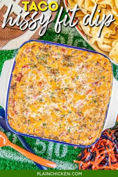 an image of a football party food spread out on the table with chips and dip