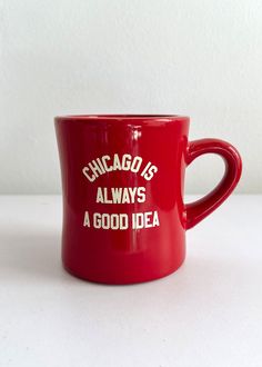 chicago is always a good idea red coffee mug with white writing on the front and bottom