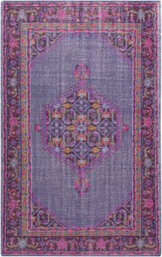 a purple rug with an ornate design on it