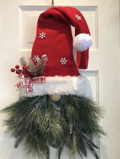 a christmas hat hanging on the front door