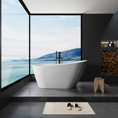 a large white bath tub sitting next to a window