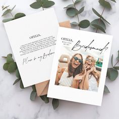 two personalized greeting cards with the same photo and text on them next to eucalyptus leaves