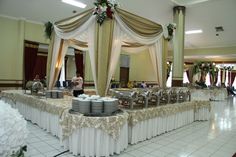 a banquet hall with tables covered in white linens