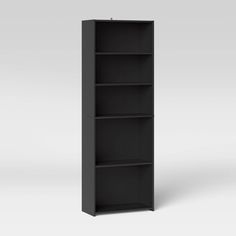 an empty black bookcase on a white background