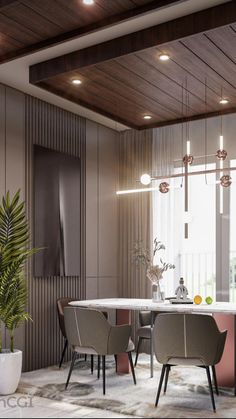 a dining room with a table and chairs next to a plant in a vase on the floor