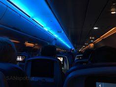 the inside of an airplane with blue lights