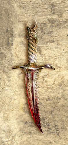 a cross made out of glass and metal with a twisted blade hanging from it's center