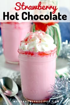 strawberry hot chocolate in a glass with whipped cream and sprinkles on top