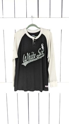 Stitches White Sox Major League Baseball long sleeve thermal baseball tee tshirt large Measurements...taken flat -marked size: large -across chest: 22" -length: 28" Features... -cotton/polyester -waffle thermal style -distressed logo Condition... -excellent vintage condition -gently worn/slight fading   9 Hook Bracelet, Mens Thermals, Thermal Long Sleeve, Fan Shirts, Grand Tour, Unisex Jewelry, White Sock, T Shirt Vest, Baseball T Shirts