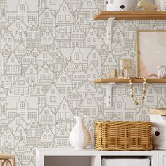 a wallpapered room with shelves and baskets