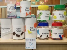 there are many jars with labels on them that say fish, turtle, and crab