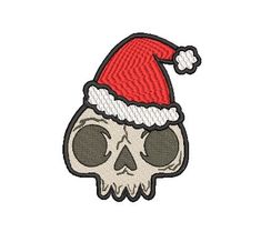 a skull with a santa hat on it's head is seen in this embroidery design