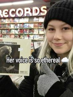 a woman holding up a record in front of her face and the words here voice is so etheral