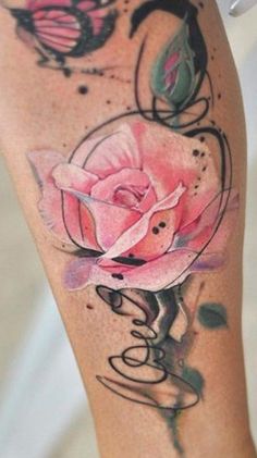 a woman's leg with a pink rose tattoo on it and butterflies flying around