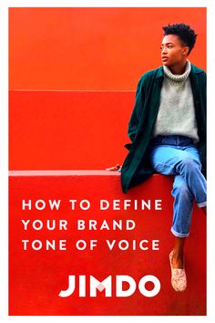 a man sitting on top of a red wall with the words how to define your brand tone of voice