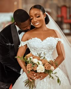 a bride and groom pose for a wedding photo