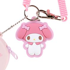 a pink hello kitty keychain hanging from a metal chain with a plastic case attached to it