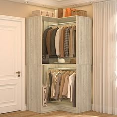 an open closet with clothes hanging in it