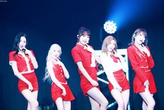 girls'generation performing on stage in red outfits