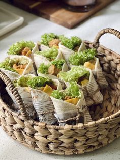 a basket filled with lots of food on top of a table