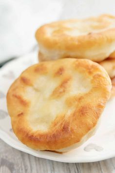 two cheese pastries on a white plate