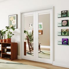 a living room filled with furniture and lots of plants