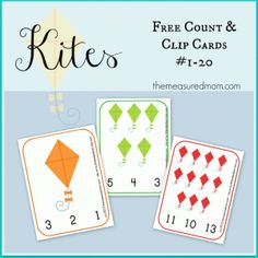 three cards with numbers and kites on them