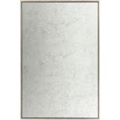 a white square mirror on a wall