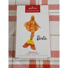 the packaging for barbie's mermaid doll is shown