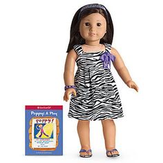 the doll is next to her book and it's price tag for $ 24