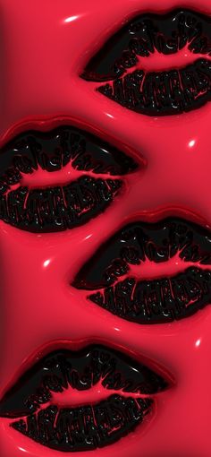 three black lips are floating in red liquid