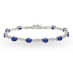 PRICES MAY VARY. Feature - This tennis bracelet displays 6x4mm oval created blue sapphire gemstones that are set in between a polished & white topaz studded swirl design. This gemstone bracelet can be purchased as tennis bracelets for women Crafted - This beautiful bracelet is crafted of 925 sterling silver and secures with a box tongue and a safety latch Satisfaction – We stand behind our products Packaging - Jewelry packaged in a box ready for gifting About – Our jewelry collection is an assor Bracelet Displays, Trendy Bracelets, Bracelet Display, Birthstone Bracelets, Women's Jewelry And Accessories, Swirl Design, Swarovski Jewelry, 925 Silver Jewelry, Tennis Bracelet